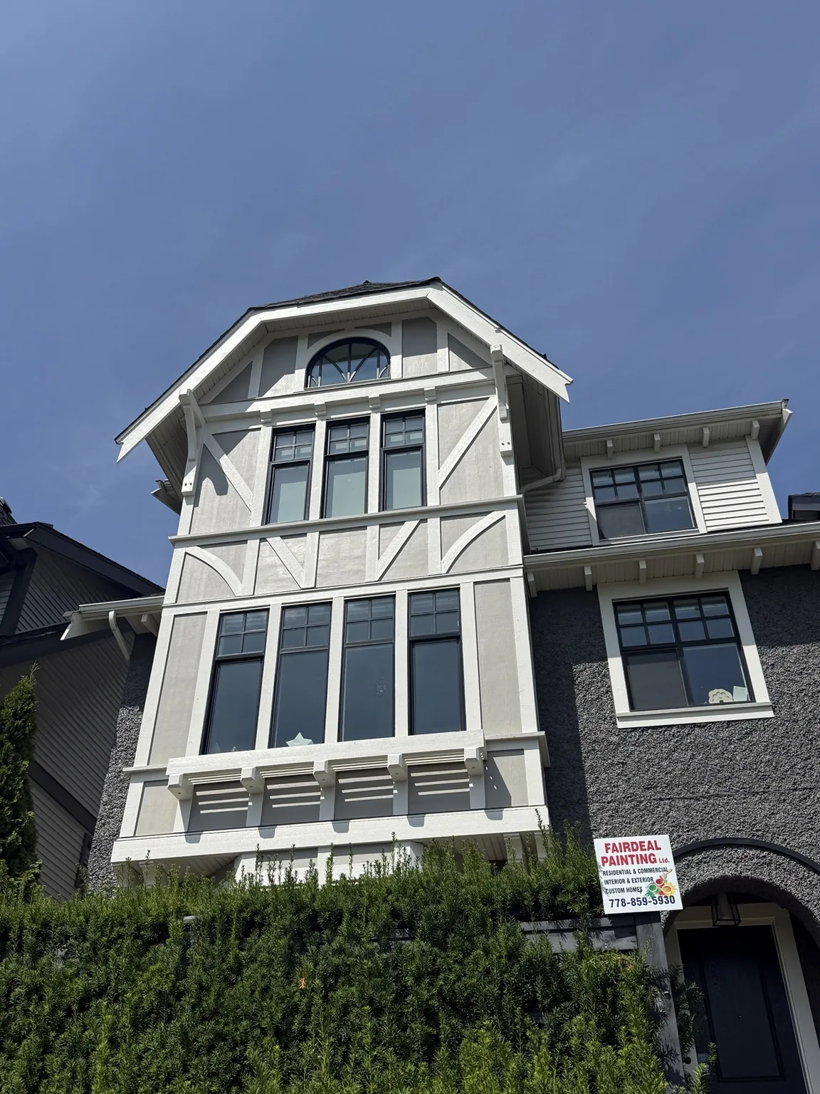 Completed exterior project with white and dark trim